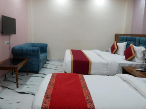 Hotel Ayushman Innにあるベッド