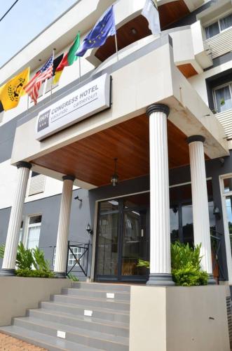 a building with flags on the front of it at CONGRESS HOTEL Yaoundé in Yaoundé