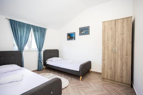 Postel nebo postele na pokoji v ubytování Apartment Fortunela