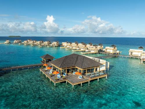 an aerial view of a resort in the water at Angsana Velavaru In-Ocean Villas in Dhaalu Atoll