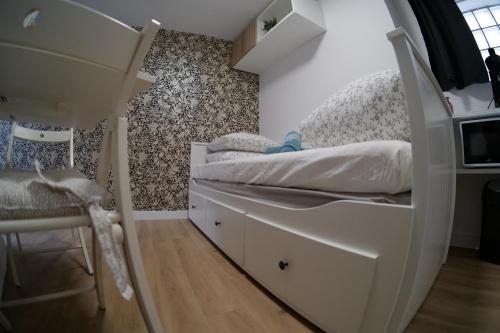 a bedroom with a bunk bed and a desk at charmante studette - 2 personnes - La Doutre in Angers