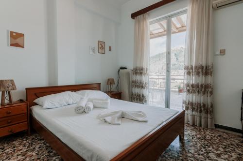 Кровать или кровати в номере Altana Vista Argolis