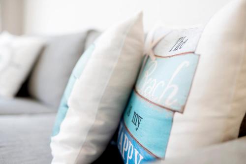 a close up of a bottle of pillows on a couch at 'Huus Stranddün' 1 in Langeoog