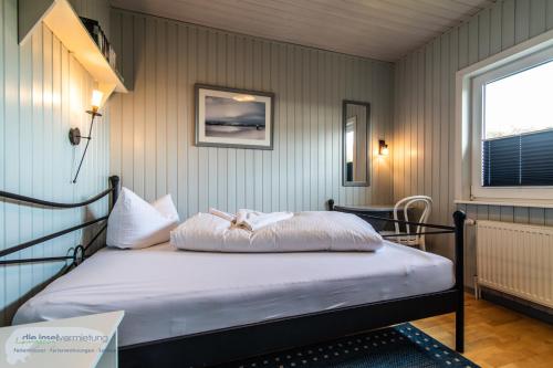 En eller flere senge i et værelse på 'Marintje'