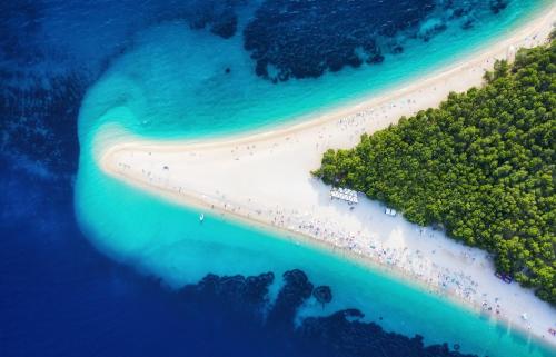 an aerial view of a beach with a group of people on it at Emerald Eco Villa in Novo Selo