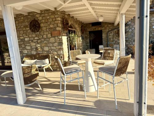a table and chairs sitting on a patio at Hotel MioMio in Tignale