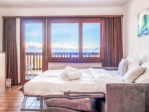 Ένα ή περισσότερα κρεβάτια σε δωμάτιο στο Apartment Arnica 16 by Interhome