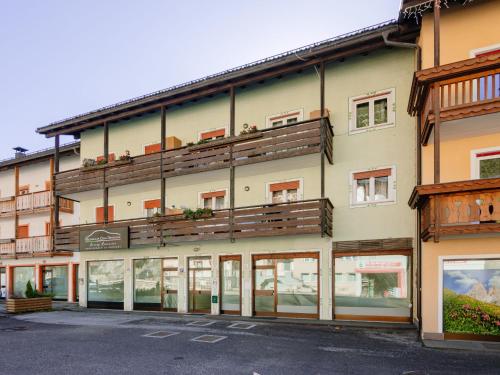 a building with balconies on the side of it at Apartment Cesa Lucilla by Interhome in Canazei