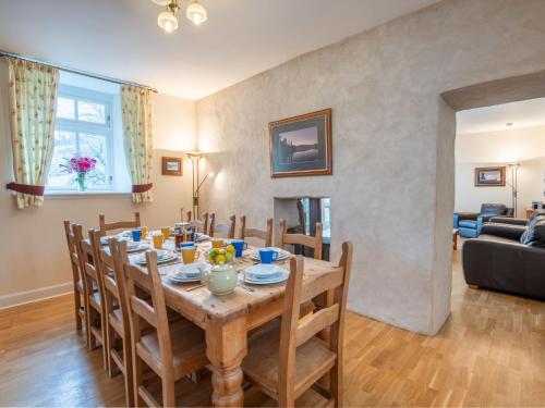 a dining room with a table and chairs at Holiday Home Old Stables by Interhome in Drumnadrochit