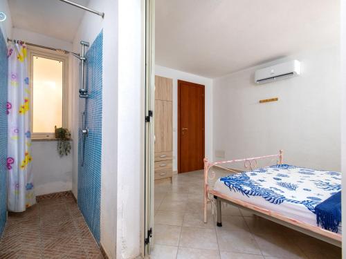 Ένα ή περισσότερα κρεβάτια σε δωμάτιο στο Holiday Home Lu Nibaru 2 by Interhome
