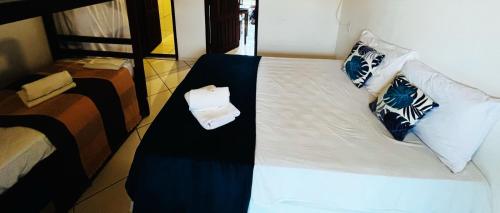 Postel nebo postele na pokoji v ubytování casa flamboyant- Apartamento com ar condicionado