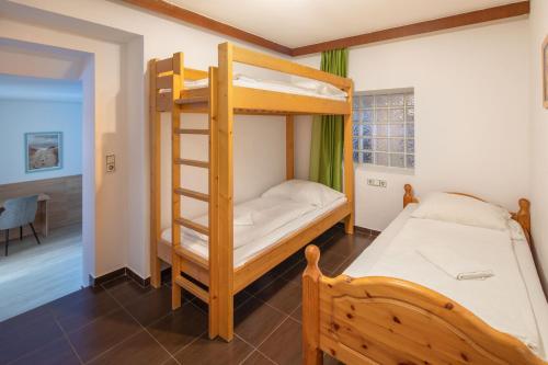 Hotel Sonnhof Raurisにあるベッド