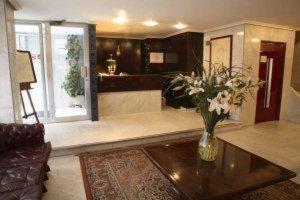 a living room with a vase of flowers on a table at Monclús in Palencia