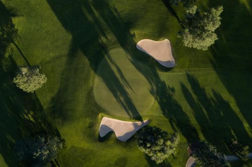an overhead view of a pair of shoes in the grass at Alpin & Wellness Resort Ludwig Royal in Oberstaufen
