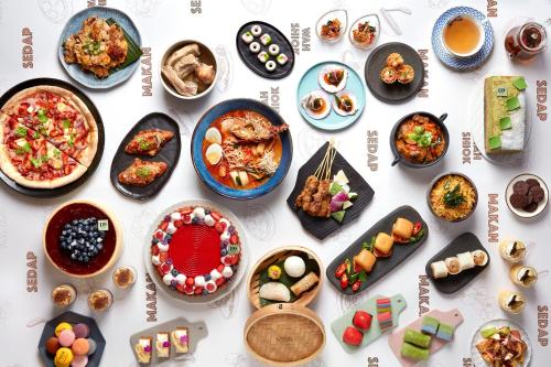 a collage of plates of food on a table at voco Orchard Singapore by IHG in Singapore