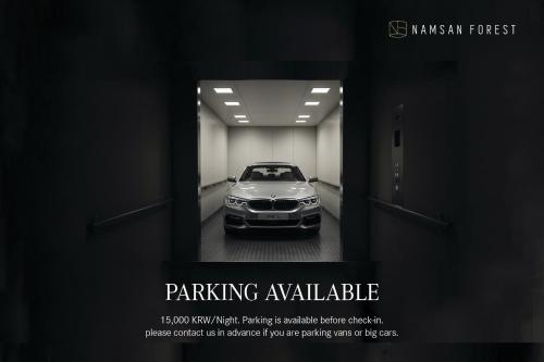 a poster of a car parked in a dark room at Namsan Forest in Myeongdong in Seoul