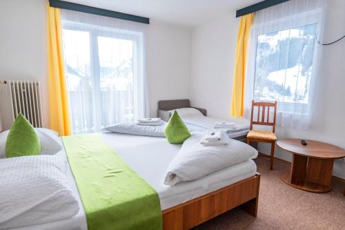 Hotel Sonnhof Raurisにあるベッド