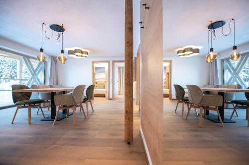 a dining room with a table and chairs at Apartments Hochbrunn - Pension Brunner in San Giuseppe in Anterselva