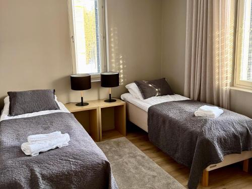 Postel nebo postele na pokoji v ubytování Levin Kunkku B6