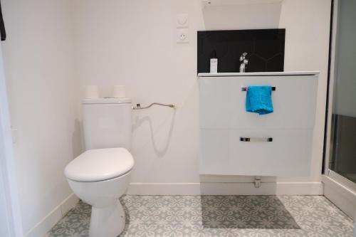 a white bathroom with a toilet and a sink at Your Home Loos 2 - Proche Lille in Loos