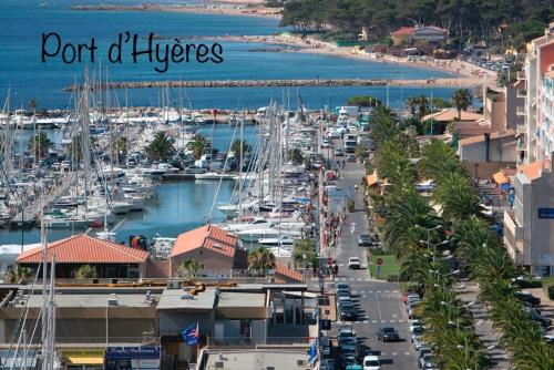 a view of a harbor with boats in the water at Le Port Plage Studio tout confort Terrasse Clim in Hyères