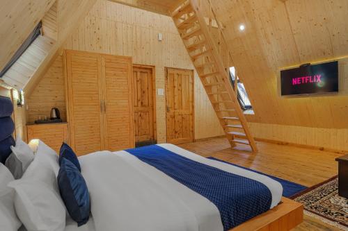 a bedroom with a bed in a wooden room at The Bagh Kufri in Kūfrī