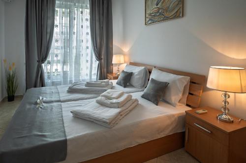 Ένα ή περισσότερα κρεβάτια σε δωμάτιο στο Apartment NORA