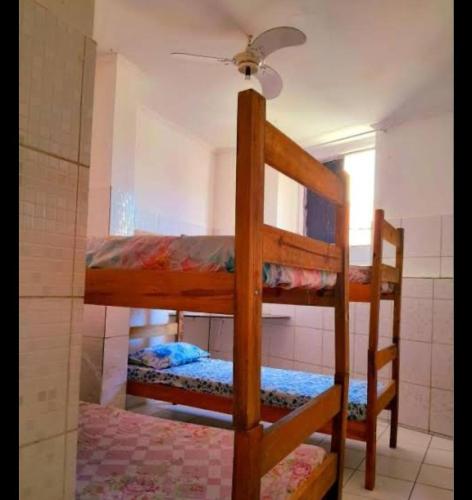 a couple of bunk beds in a room at Yellow house 1 in Salvador