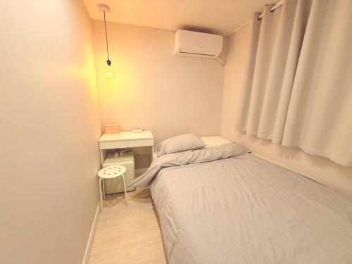 Letto o letti in una camera di GreeneStay Sindang DDP Seoul