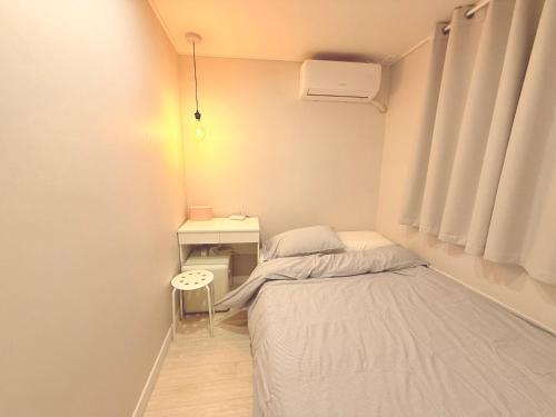 Letto o letti in una camera di GreeneStay Sindang DDP Seoul