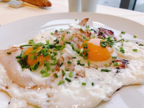 a plate of food with an egg on top at Hotel Berg in Staré Splavy