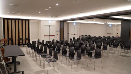 a room with rows of chairs and tables in it at Best Western Hotel Massafra in Massafra