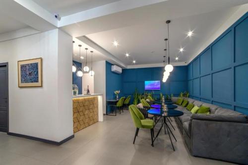 a living room with a couch and a table at Benefice Hotel Yerevan-通緝 in Yerevan