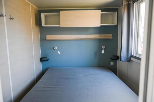 Postel nebo postele na pokoji v ubytování Ferienpark Süderstapel - Eidernest 3