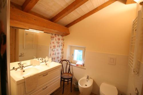 a bathroom with a sink and a toilet at CantoQuinto Bed and Breakfast in Fivizzano