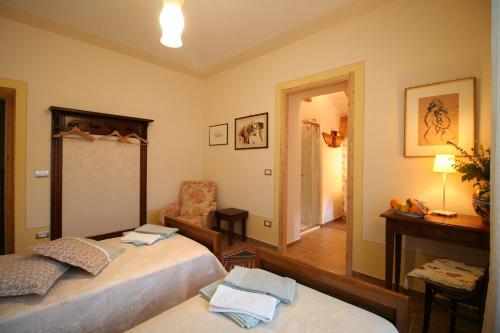 Postel nebo postele na pokoji v ubytování CantoQuinto Bed and Breakfast