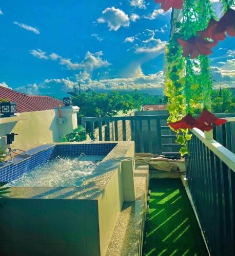 a plunge pool on the balcony of a house at Couple - Private Jacuzzi Pool in Mabalacat