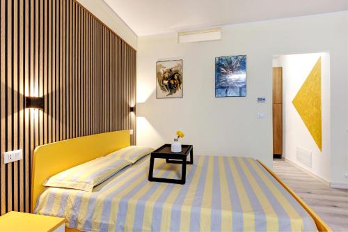 Ένα ή περισσότερα κρεβάτια σε δωμάτιο στο Casa Cattaleya