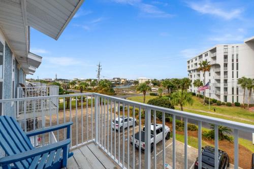 a balcony with a view of a parking lot at Bikini Bottom Destin Harbor Private Gated Beach in Destin