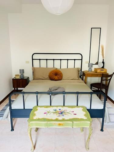 a bedroom with a bed with a pumpkin on it at Appartamento con Vista Panoramica e Garage Ideale per Famiglie 4 Persone in Fiuggi