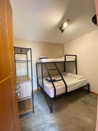 a room with two bunk beds in it at MADÁ hostel in Sao Paulo