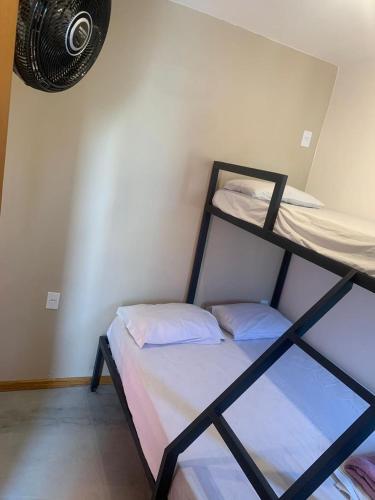 a bedroom with two bunk beds in a room at MADÁ hostel in Sao Paulo
