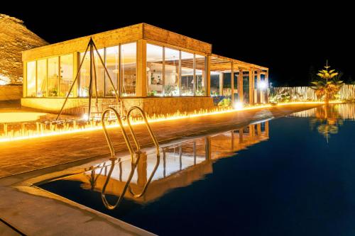 a building with a pool of water at night at Hotel Dakhla Club & SPA in Dakhla