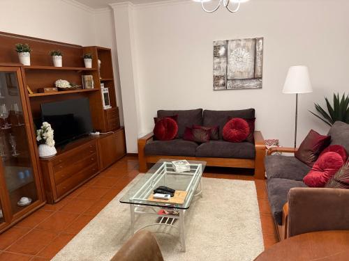 a living room with a couch and a coffee table at Quinta de São Domingos house in Peso da Régua