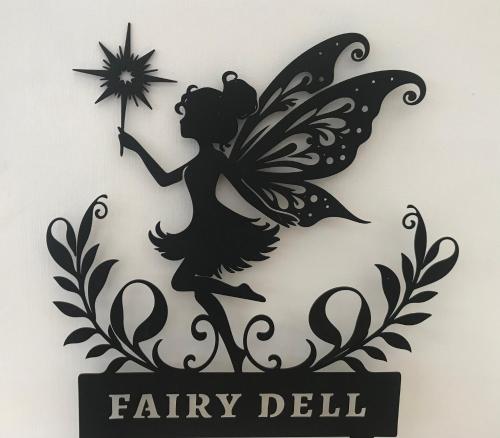 a silhouette of a fairy doll holding a star at fAiRy DeLL Guesthouse, with cozy lockable rooms, tv, tea tray with choccies, free wifi and parking, 24hr check in, COA, all are welcome in Bradford