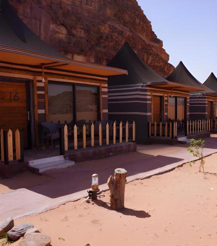 a house with a fire hydrant in front of it at Sofia Valley Camp in Wadi Rum