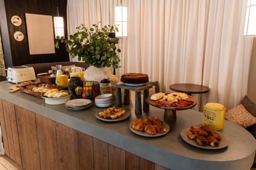 a buffet with many different types of food on it at Casa Teva Lisboa Boutique Hotel by chic&basic in Lisbon