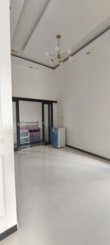 an empty room with a couch and a ceiling at Assa House in Pontianak