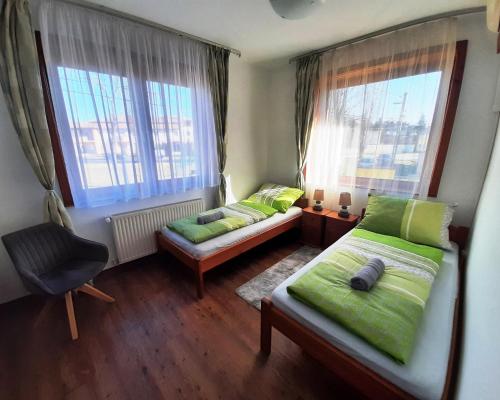 Postel nebo postele na pokoji v ubytování Szt Kristóf Bed and Breakfast