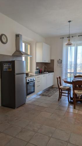 Kuchyň nebo kuchyňský kout v ubytování Casa Maddi Casa Vacanze con Vista Mare Vicinissima al Centro Capoliveri Isola d'Elba